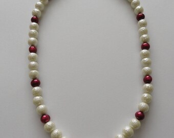 Cranberry fresh water pearl and ivory-coloured glass necklace