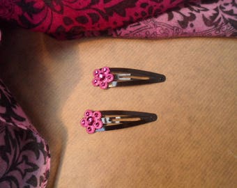 Child or baby with little fuchsia flower hair clip