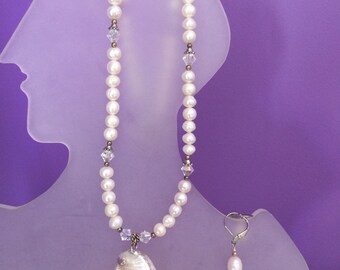 Freshwater pearls with the shell pendant
