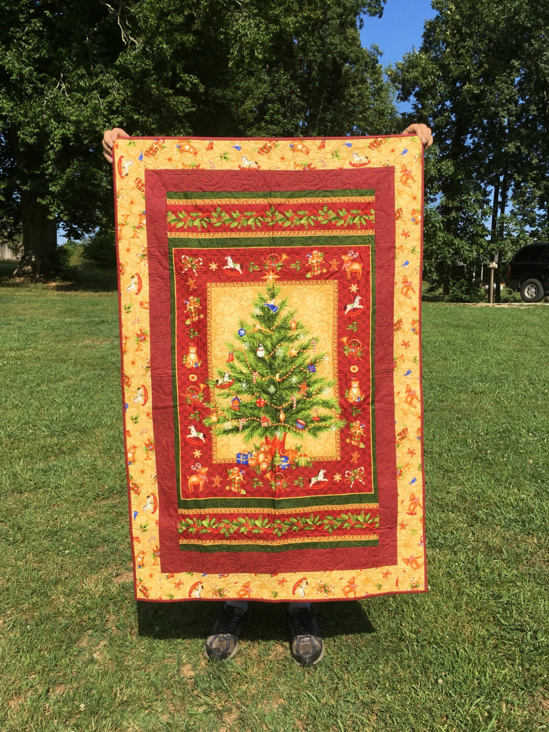 Small quilted Christmas wall hanging quilt. Panel by Northcott