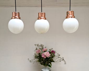 Vintage milk glass balls. copper supports