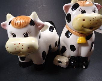 Black an white cow sugar and creamer