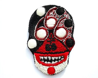 Embroidered brooch "666"