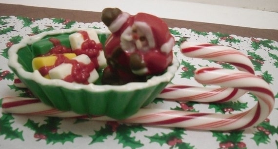 Santa and presents in a chocolate sleigh with candy cane runners