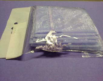 Ten purple pouches that closes with a satin ribbon