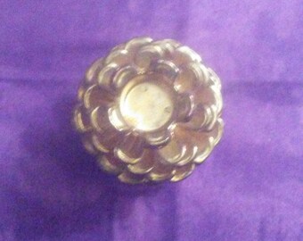Brass pine cone candle holder
