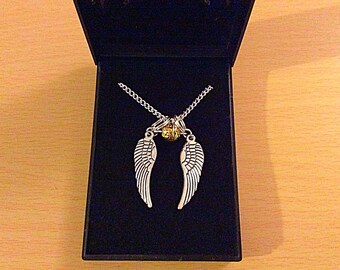 Angel wings golden snitch necklace