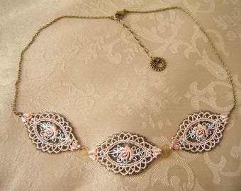 Shape of gears and a pink rose necklace