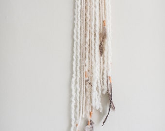 White yarn weaving wall hanging