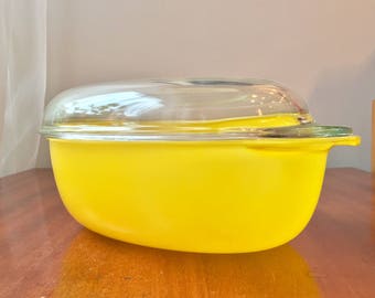 Vintage 1970s yellow casserole perfect for a retro kitchen