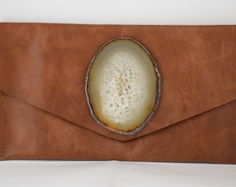 handmade copper cow leather envelope style clutch with a gold oval geode crystal
