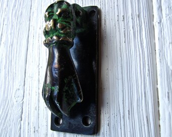 Solid brass hand door knocker