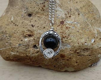 Astrophyllite Pendant. Small Rare crystal. Reiki jewelry uk. Oval frame necklace. Wire wrapped pendant. 10mm stone