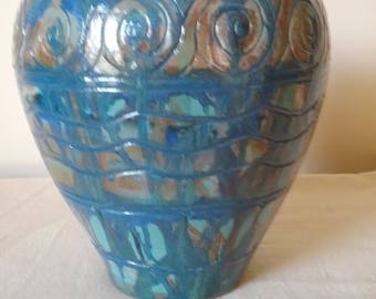 Large pottery urn vinegar painted in blue and sienna over teal