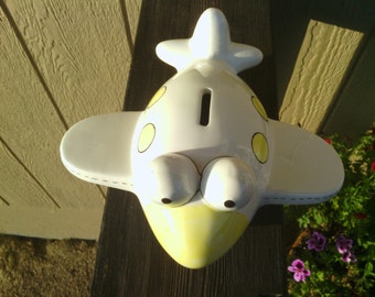 Cute Penny Bank in an Airplane Figure.