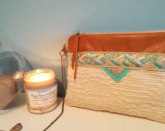 Clutch bag in leather and cotton weaving effect