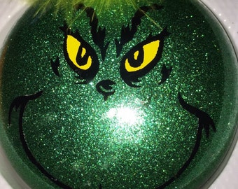 Grinch glittered Christmas Ornament can be personalized
