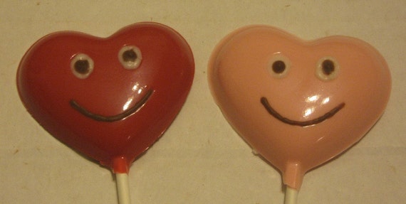 One dozen Heart lollipops with smiley faces