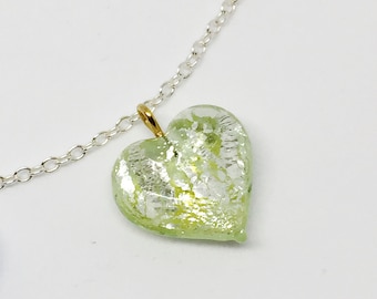 Morning glory heart necklace features a volcano glass