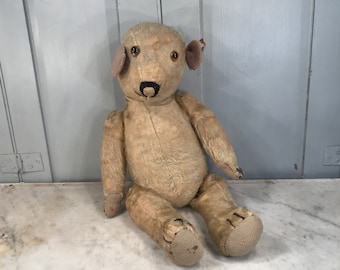 Antique straw filled teddy bear