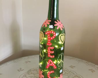 Painted recycled wine bottle with lights