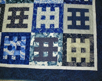 Blue and white "Gates of Serenity" lap quilt