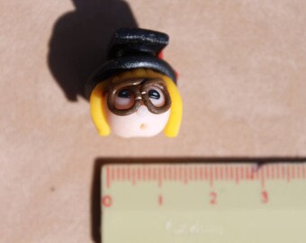 "Graduate" polymer clay face bead