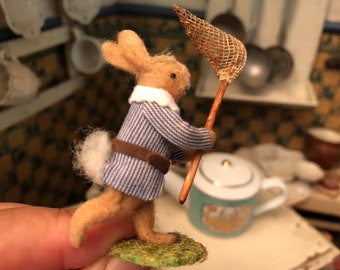 Petit lapin et son filet à papillon