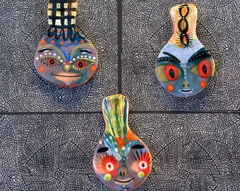 Three Face Shaped Refrigerator Magnets by Jenny Mendes
