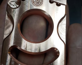 Copper bottle opener with key ring holes