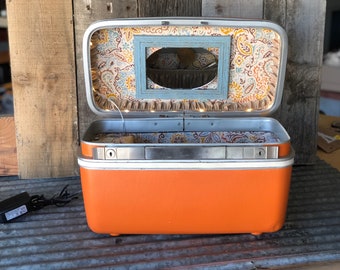 Samsonite train case repurposed into bluetooth makeup/accessory case