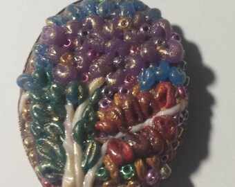 Pendant, polymerclay, tree with flowers, pinks, blues and greens.
