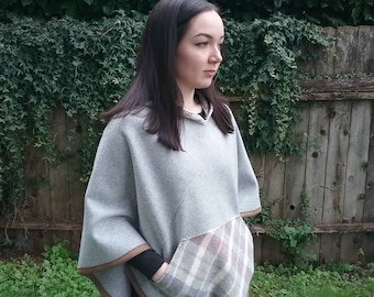Hooded wool poncho has a handy kangaroo pocket & fun fringed hood. Made completely of wool from Pendleton.