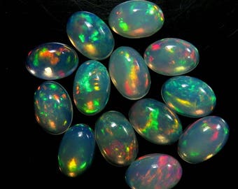 AAAA+++ Natural Ethiopian Welo opal oval Cabochon Gemstone 5x7mm High Grade Smooth Opal Multi Fire Play Opal At Wholesale Price per pc