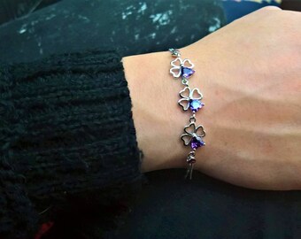 Silver plated heart-shaped clovers with purple rhinestones!
