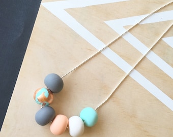 Polymer clay necklace. Mint, copper, peach, white and grey 'the piper'