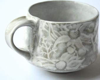 Cup with Australian Flannel Flower design - White and buff stoneware ceramic cup