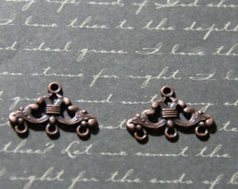 2 connectors with volutes 16x24mm coppered metal