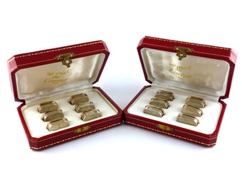 CARTIER * Rare suite de porte-noms en argent massif et vermeil modèle emblématique "TRINITY"