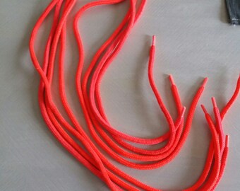 four neon orange vintage shoe laces