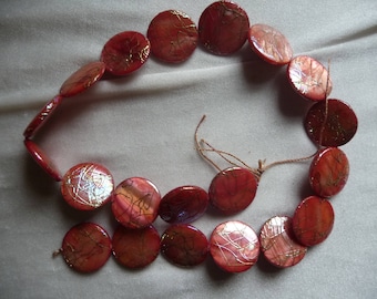 Beads, Mother of Pearl, 20mm Flat Round Coin, Shades of Orange with Design. Sold per 15 inch strand. There are 20 beads on the strand.