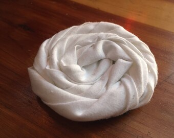 White rolled flower clip