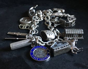 Sterling charm bracelet, vintage souvenirs of a traveller and skier.