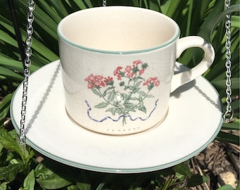Hanging Repurposed Retro White Green Trimmed Teacup Bird Feeder with Pink Flower Verbena Plant
