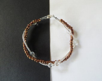 Two strand twisted bracelet silver and bronze coloured
