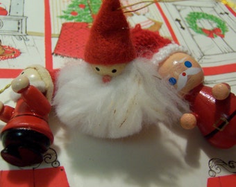 three wee wooden santa's