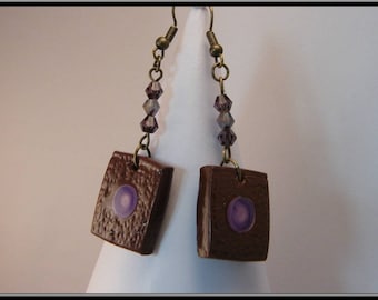 Polymer clay earrings with inlay paint and resin.
