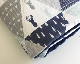 Whole cloth triangle patchwork crib sized quilt