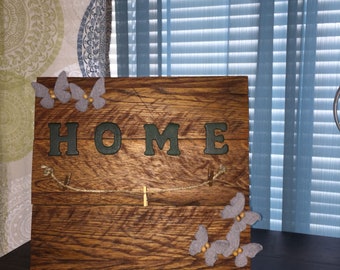 Beautiful home sign with places to hang up pictures