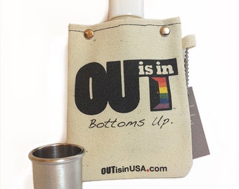 OUT is in Canvas Flask, with shot glass, pride flask with shot glass, rainbow pride flask